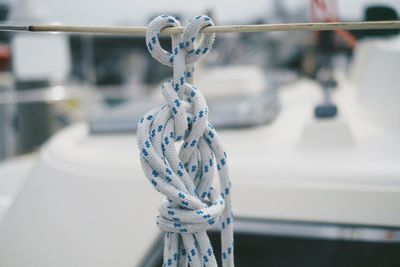 Close-up of rope tied on railing