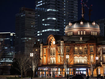 Low angle view of illuminated buildings at night