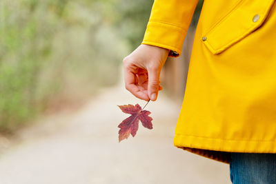 Midsection of woman holding gift