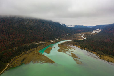 Scenic view of lake and mountains against sky