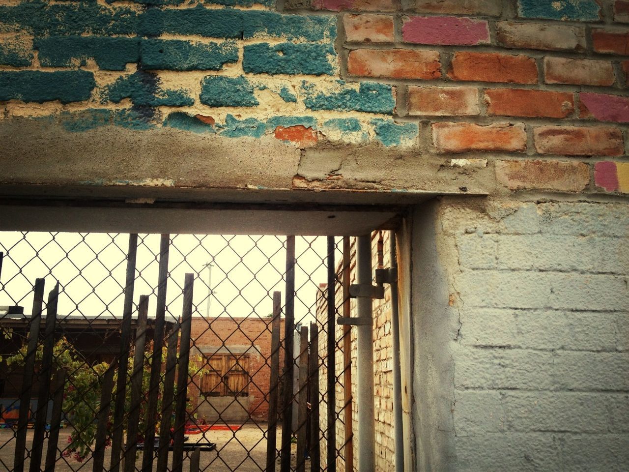 architecture, built structure, building exterior, weathered, wall - building feature, old, window, door, damaged, brick wall, closed, protection, abandoned, house, safety, deterioration, run-down, wall, security, obsolete