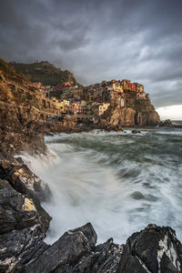 Scenic view of sea and rocks against sky