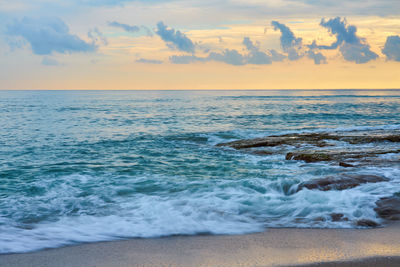 Scenic view of sea against sky during sunset