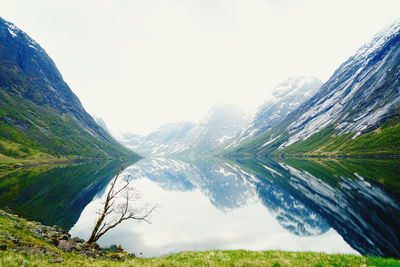 Scenic view of snowcapped mountains against sky