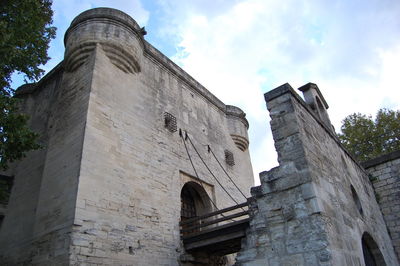 Low angle view of historic tower against sky