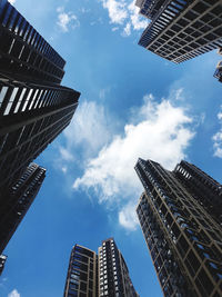 Low angle view of modern buildings against sky