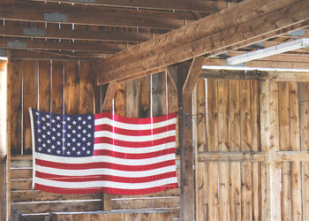 Flag hanging on wall of building