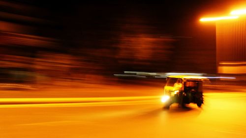 Blurred motion of illuminated car at night