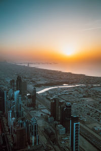 High angle view of cityscape against sky during sunset