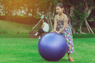 Full length of girl on field