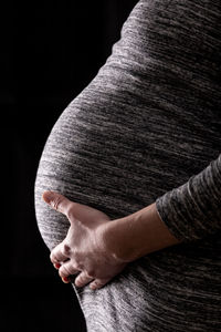 Midsection of woman holding hands