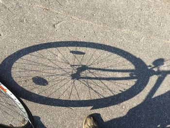 High angle view of bicycle shadow on street