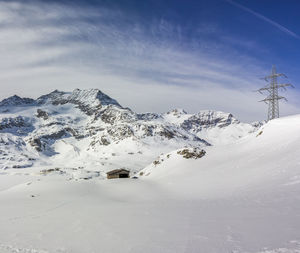 Close-up of snow covered mountains against sky