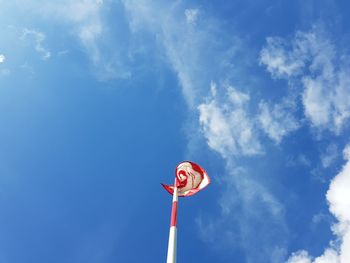 Low angle view of street light against blue sky