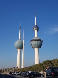 Low angle view of communications tower against blue sky