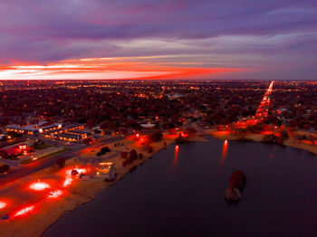 High angle view of illuminated city buildings at dusk