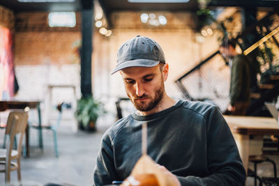 Handsome man sitting in cafe