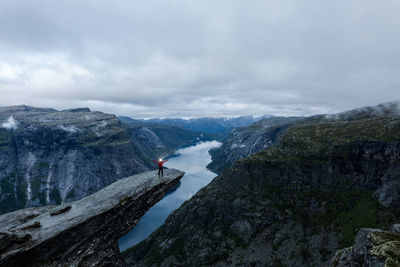 Scenic view of mountains and river against sky