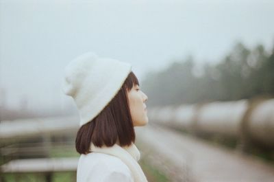 Side view of beautiful young woman with eyes closed