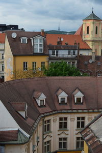 Residential buildings in town against sky