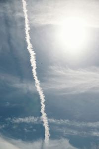 Low angle view of vapor trails in sky