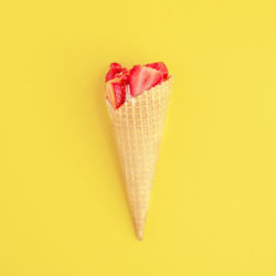 Close-up of cake against yellow background