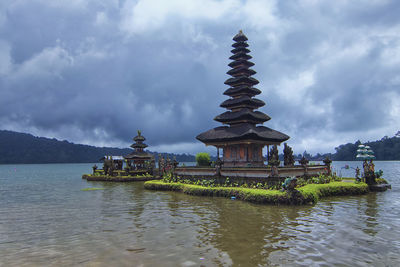 Unique architectural design of a floating tample at bratan lake inspired by balinese hinduism