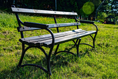 Empty bench in park