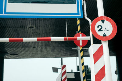 Close-up of traffic sign at highway toll booth 