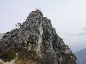 Low angle view of rock formation against sky