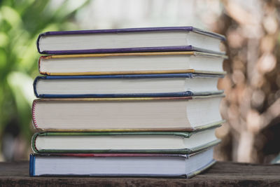 Close-up of books stacked on table