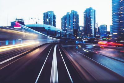 Blurred motion of train on road at night