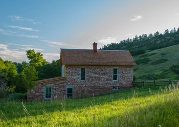 House on field against sky