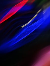 Close-up of light painting against black background