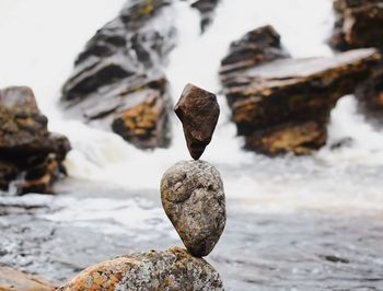 Close-up of stone stack on rock