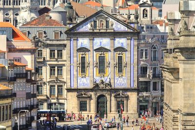 High angle view of people by buildings in city