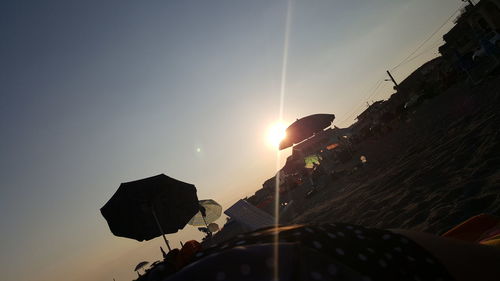 Low angle view of silhouette buildings against sky during sunset