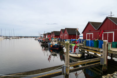 Boats moored at harbor