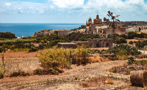 Small coastal village with old buildings and church