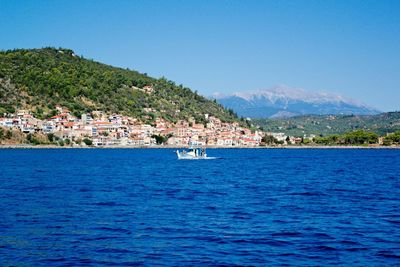 Scenic view of sea against clear blue sky
