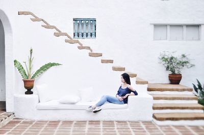 Woman sitting on steps