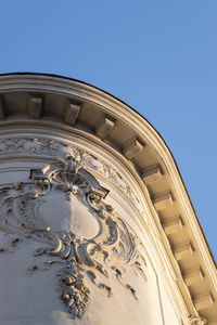 Low angle view of art nouveau building against clear blue sky