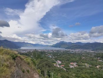 Scenic view of landscape and mountains against sky