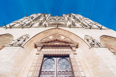 Low angle view of building against blue sky