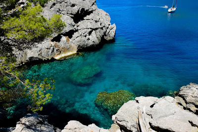 High angle view of rocks by sea