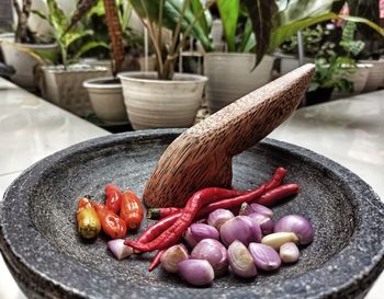 A traditional recipe in the form of red onions and red chilies on a traditional west java pulverizer