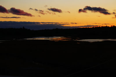 Scenic view of silhouette landscape against romantic sky at sunset