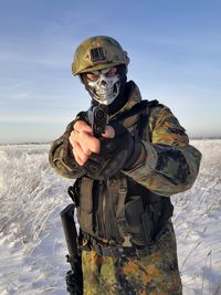 Portrait of man standing in snow