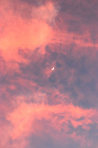 Low angle view of dramatic sky during sunset