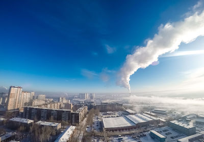 Aerial view of city against sky during winter